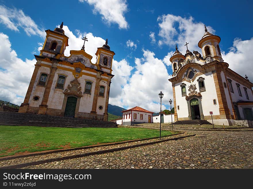 Church in the beautiful old town in colonial style  Mariana and  sky and clouds at background, Brazil. Church in the beautiful old town in colonial style  Mariana and  sky and clouds at background, Brazil