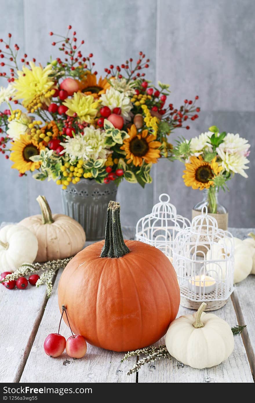 Bouquet of sunflowers and hypericum berries, candles, lace. Postcard motif