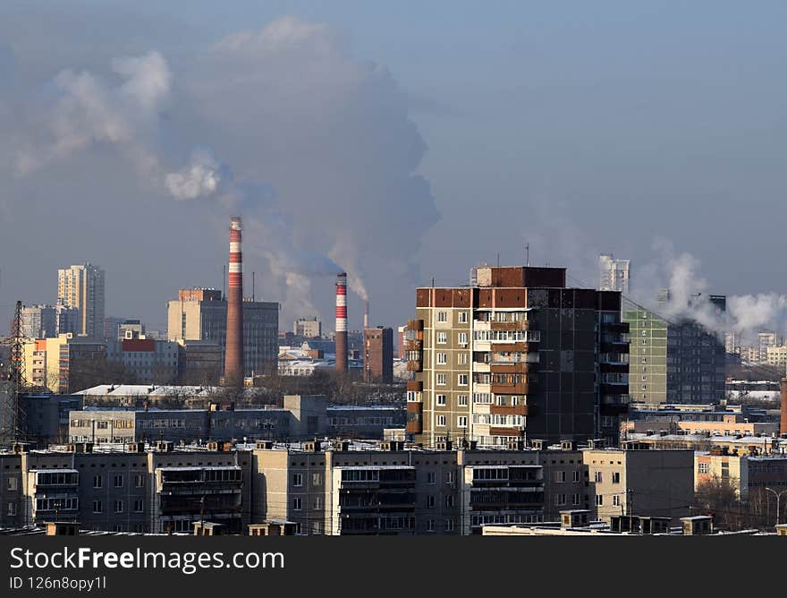 Smoking chimneys in the big city, factory and houses, industry. Smoking chimneys in the big city, factory and houses, industry