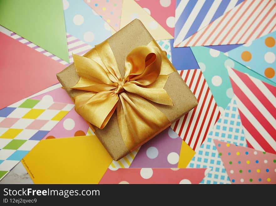 Top View of Gift box present with space copy on colorful background. Top View of Gift box present with space copy on colorful background
