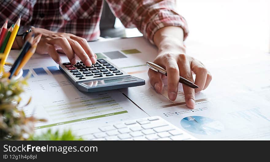 Business woman working in finance and accounting Analyze financial budget - work from home concept.