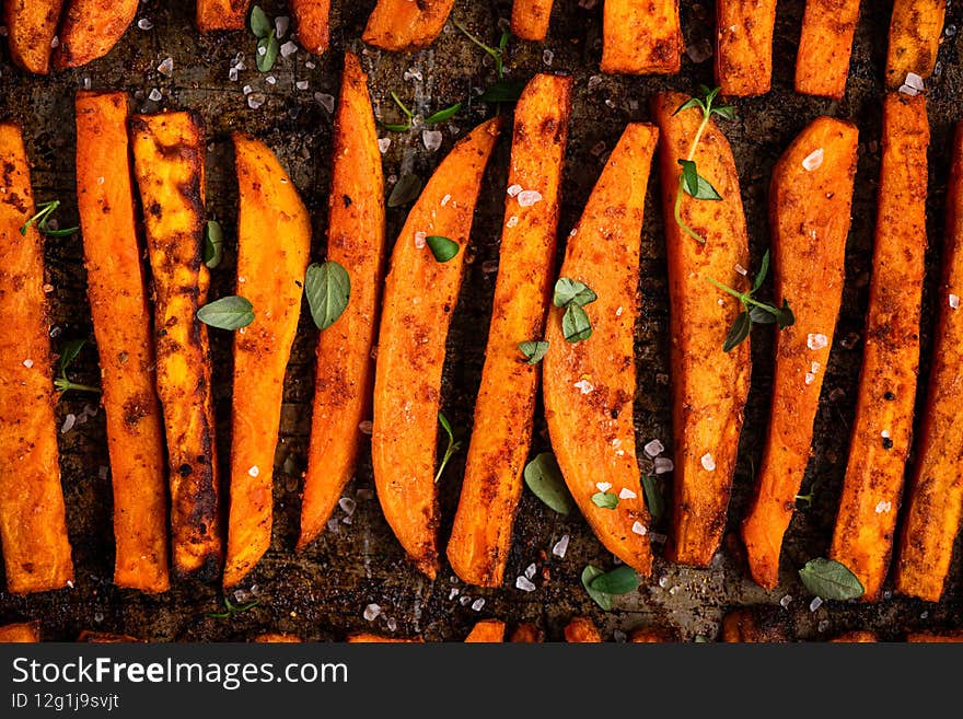 Sweet Potato Homemade Fries Chips with Herbs and Salt. Baked in Owen Potato Chips