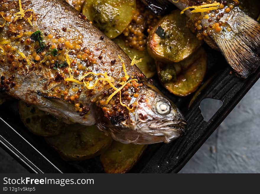 Grilled Whole Fish on Potatoes. Top Down View