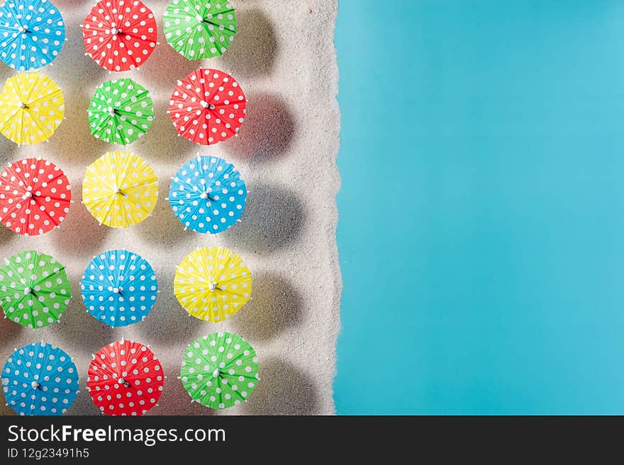 Colorful Beach Umbrellas Top Down View on Sandy Beach. Vacation Concept. Still Life Art
