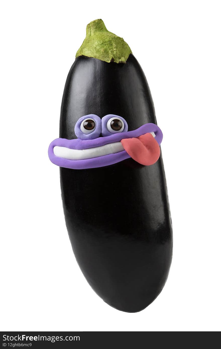 Cartoon character eggplant with eyes and smile isolated on white. Plasticine parts of face on fruit. Photo for children&#x27;s menu. Cartoon character eggplant with eyes and smile isolated on white. Plasticine parts of face on fruit. Photo for children&#x27;s menu