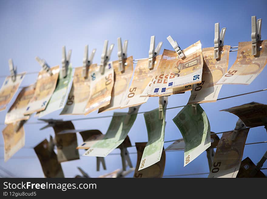 100 and 50 euro banknotes drying. Washed Euro paper bills. Drying euro on a string.Money laundering