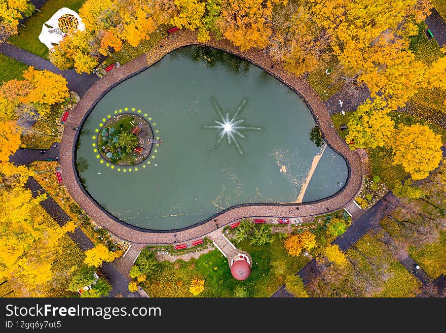 A small island for ducks. View of the fountain from a drone. The fountain is like a star. A small island for ducks. View of the fountain from a drone. The fountain is like a star.