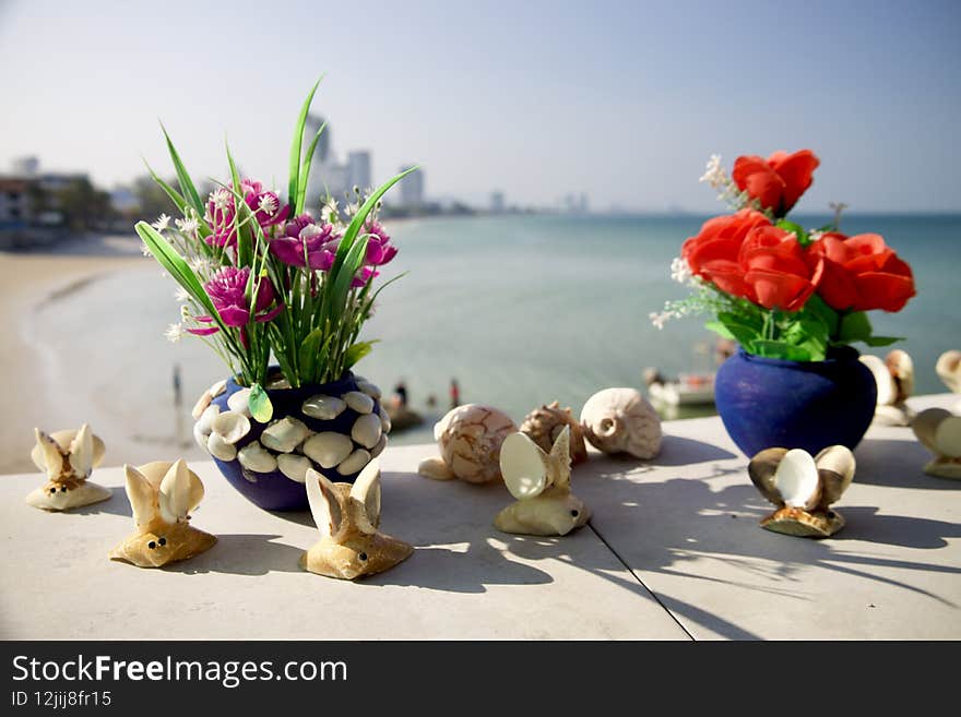 A beautiful shot of decorations on a pavement near water