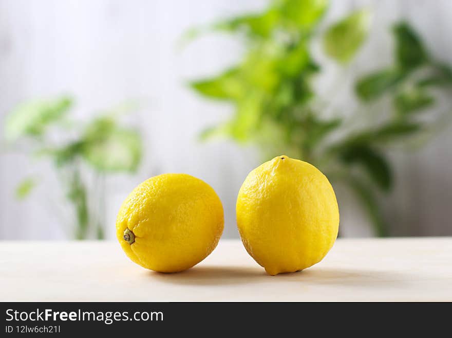 Fresh Lemon or lime a yellow ball on the cooking table