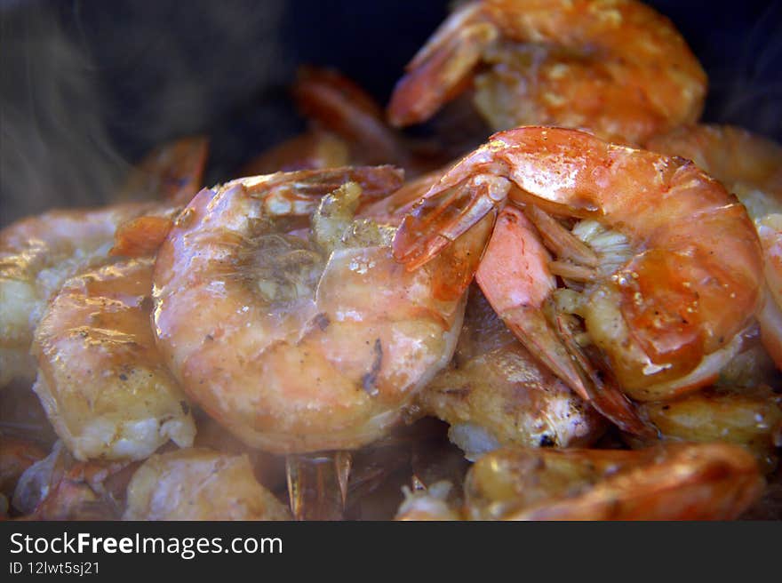 Fresh Scampy shrimp, sizzling on a bar-b-que grille, smoked with alder chips, and cooked to perfection to be served with smoked salmon and cornbread. Fresh Scampy shrimp, sizzling on a bar-b-que grille, smoked with alder chips, and cooked to perfection to be served with smoked salmon and cornbread