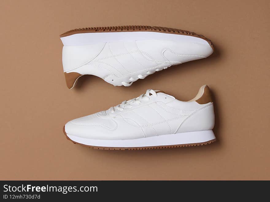 men&#x27;s sneakers on a colored background top view. men&#x27;s footwear. minimalism. High quality photo