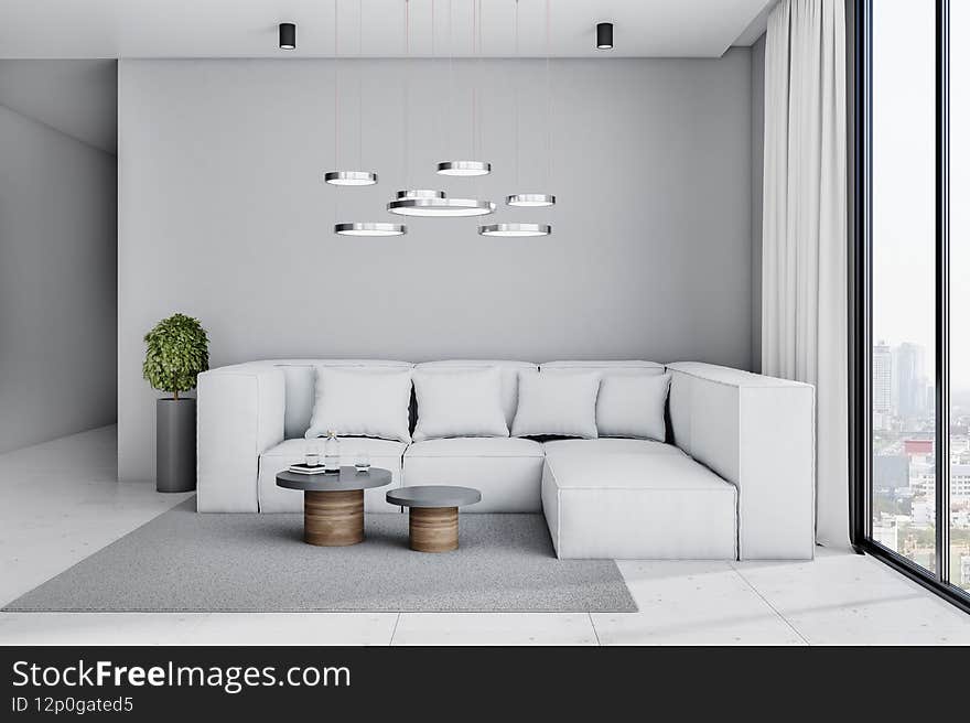Stylish living room in cold shades interior design with light big sofa, grey carpet with coffee tables on marble floor, modern