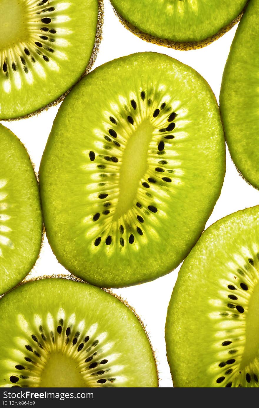 Fresh kiwi slices isolated on white background, close-up, top view