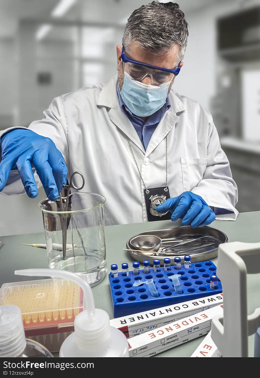 Police scientist is holding scissors in beaker in crime lab, concept image