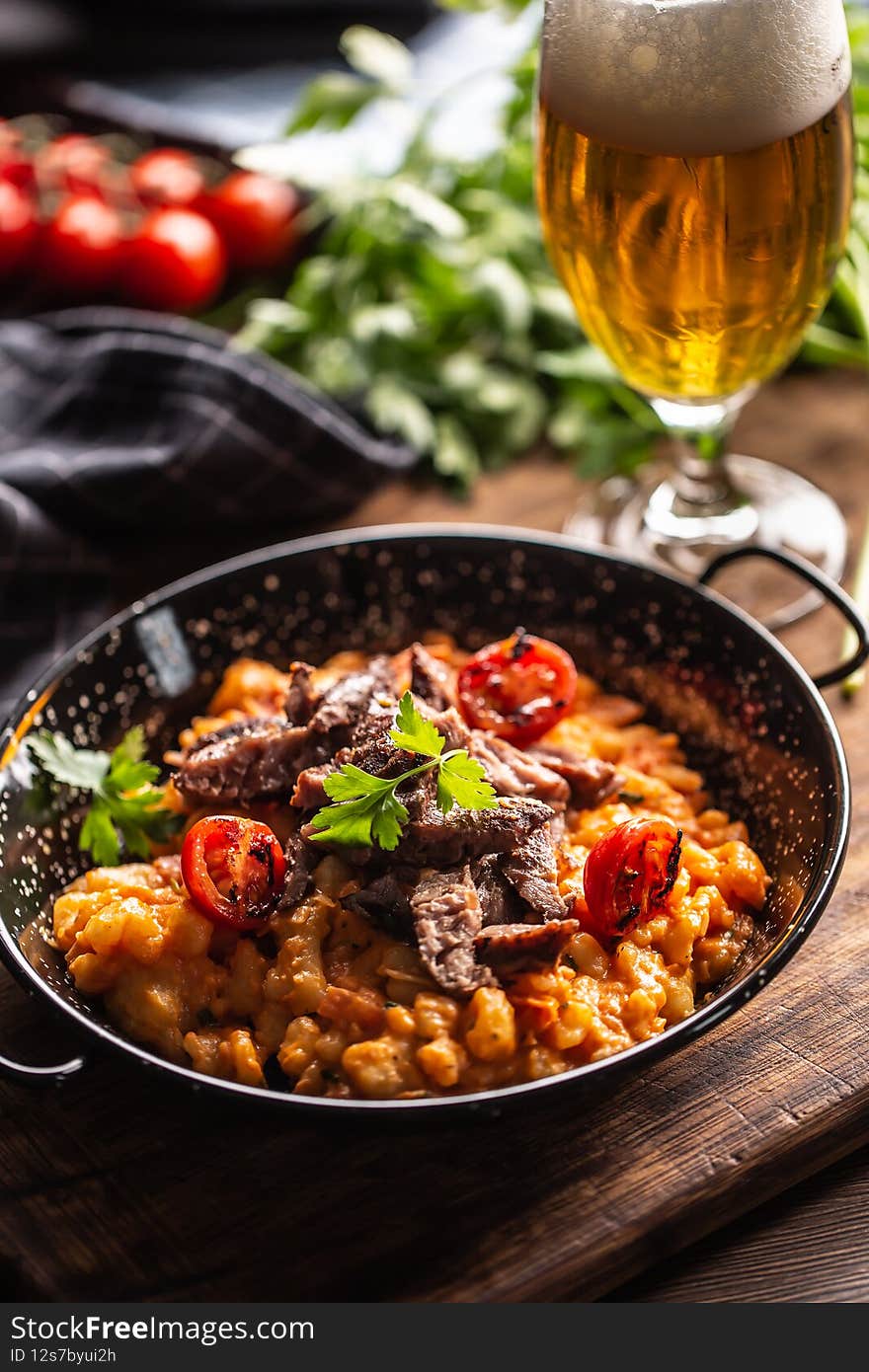 Italian gnocchi in tomato sauce, served with sous vide beef and topped with fresh parsley