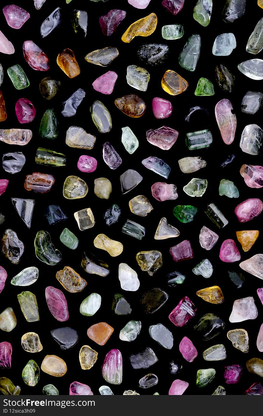 Tourmaline rare stones texture on black background