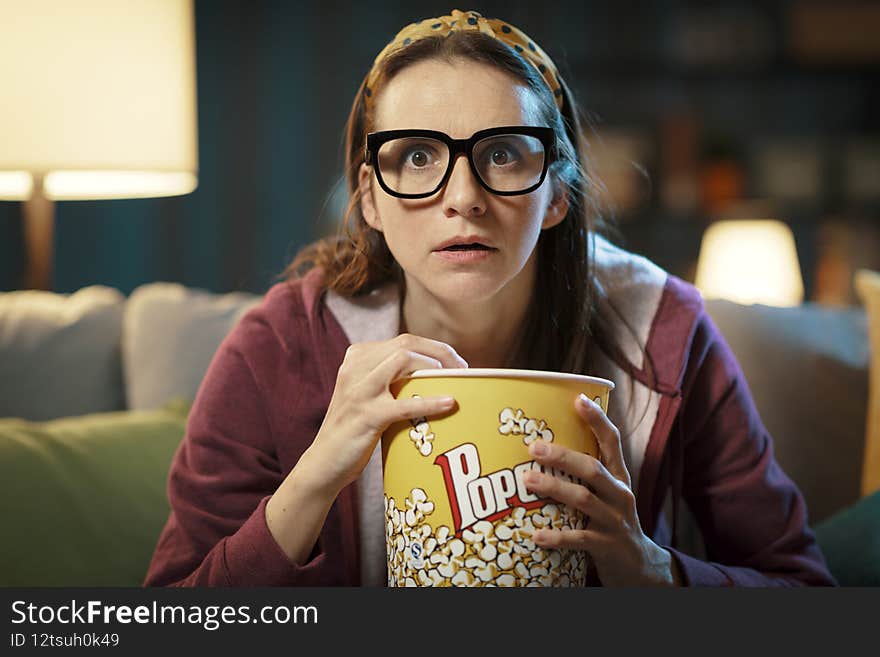 Woman watching a suspense movie