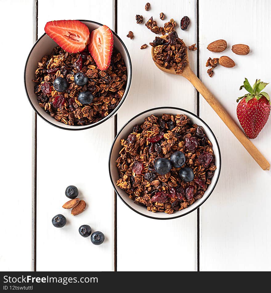 Home-made Baked Granola In Two Bowls, With Berries And Almonds