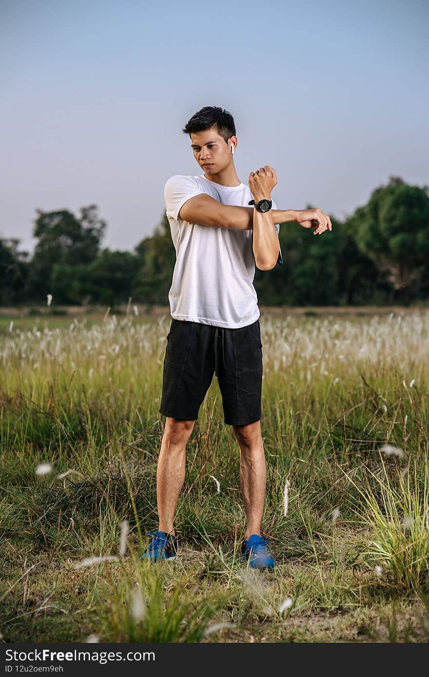 Men warm up before and after exercising. Selective focus