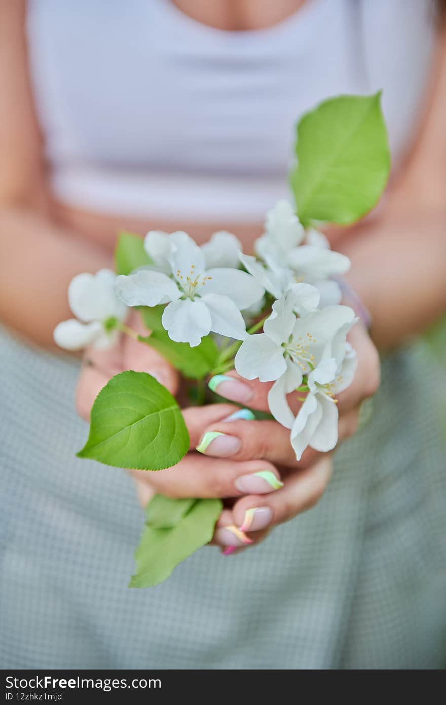 a bouquet of white flowers in hands. High quality photo