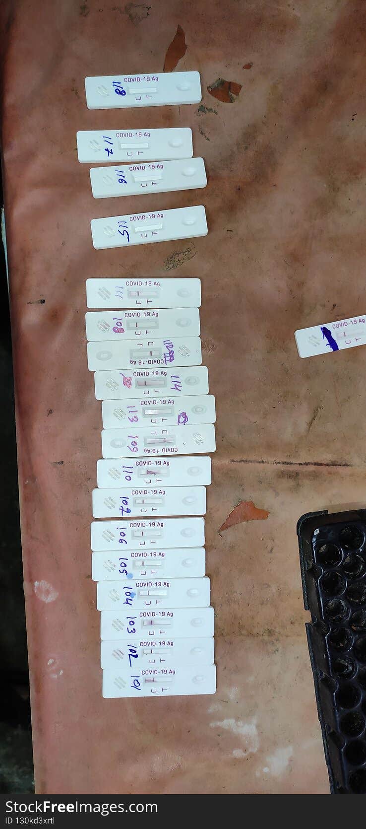 Corona virus Covid19 rapid antigen testing kit under observation after swab collection and test on the table numbered arranged..