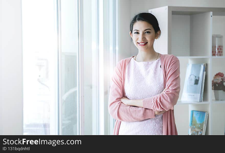 Confident Businesswoman Smiling In Modern Office.