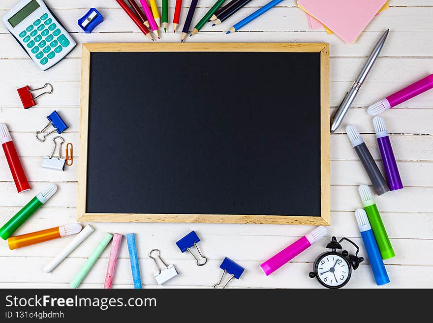 Various school supplies on a wooden table