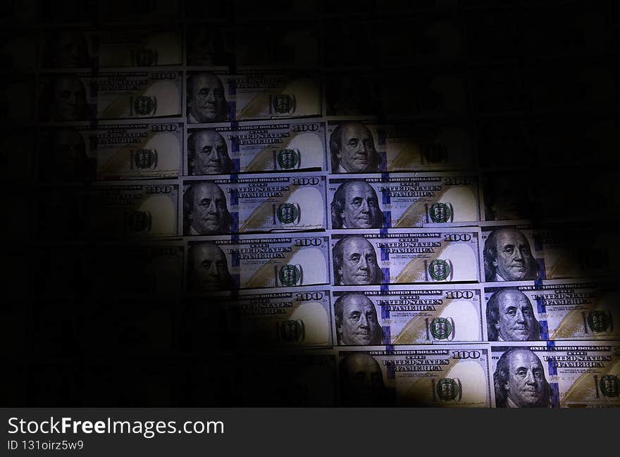 Counterfeit money checking with ultraviolet lamp. Fraud crime. Financial and economic crisis. Dollar currency notes. Inflation rate. Robbery concept.