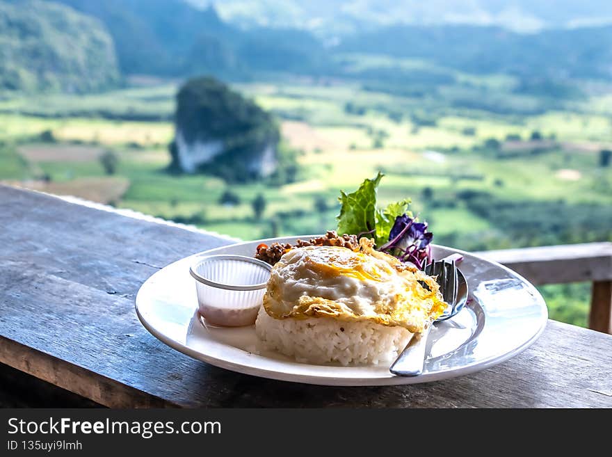 Basil fried rice with fried egg in Phu Lanka. Have breakfast, enjoy the view. Basil fried rice with fried egg in Phu Lanka. Have breakfast, enjoy the view