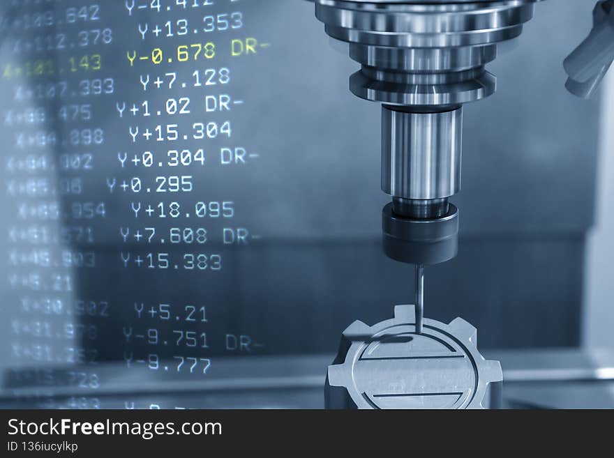The abstract scene of CNC milling machine cutting the graphite electrode material and G-code data background. The electrode cutting process  by machining center