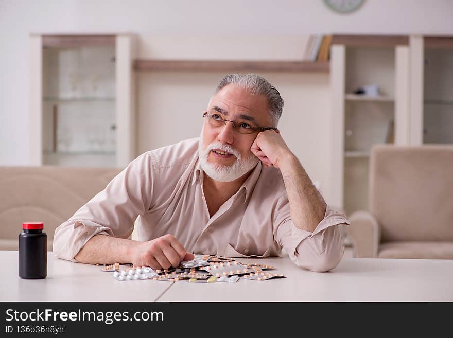 Old sick man suffering at home