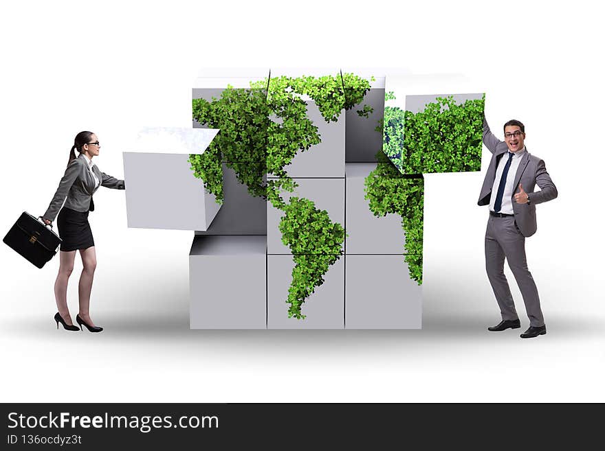 Business people building world map from the cubes