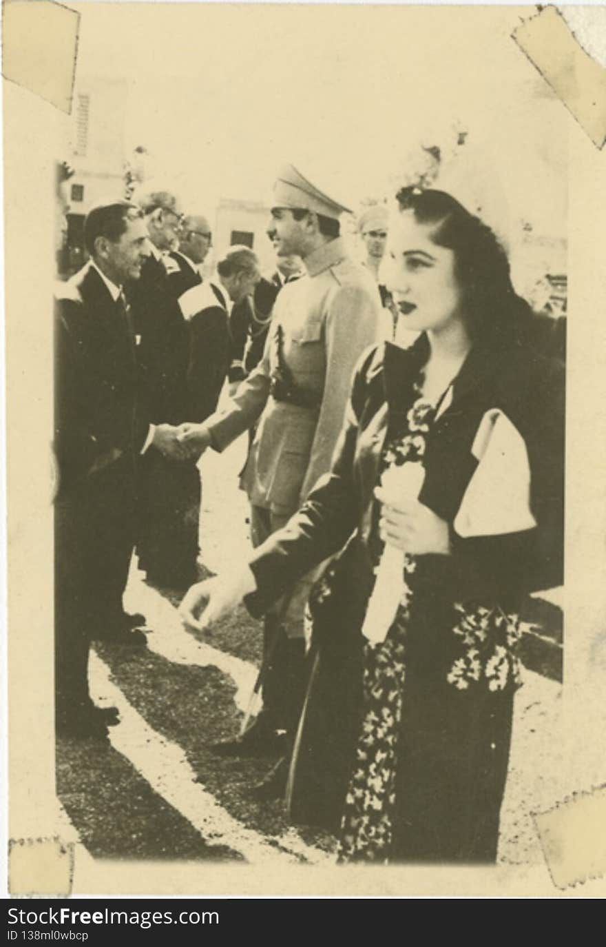 Description:  Text on photograph, “A picture of the King and Queen at a reception. She is very attractive and dresses very modern. December 1943.”

Photographer: unknown

Date:  December 1943

Medium: Black and white photograph

Repository: American Jewish Historical Society

Parent Collection: National Jewish Welfare Board Military Chaplaincy Records, 1917-1983 &#x28;I-249&#x29;

Call number: aa-i249-b35-f263-011

Rights Information: No known copyright restrictions; may be subject to third party rights. For more copyright information, click here.

 The original photographs  found in Box 35, Folder 263 from Series IV, Subseries 4 of the National Jewish Welfare Board Military Chaplaincy records &#x28;I-249&#x29;. See more information about this image and the collection by viewing the finding aid: Guide to the National Jewish Welfare Board Military Chaplaincy Records.

To inquire about rights and permissions, or if you have a question regarding the collection to which the image belongs, please contact the Reference Department of the American Jewish Historical Society by email.

Digital images created by the Gruss Lipper Digital Laboratory at the Center for Jewish History. Description:  Text on photograph, “A picture of the King and Queen at a reception. She is very attractive and dresses very modern. December 1943.”

Photographer: unknown

Date:  December 1943

Medium: Black and white photograph

Repository: American Jewish Historical Society

Parent Collection: National Jewish Welfare Board Military Chaplaincy Records, 1917-1983 &#x28;I-249&#x29;

Call number: aa-i249-b35-f263-011

Rights Information: No known copyright restrictions; may be subject to third party rights. For more copyright information, click here.

 The original photographs  found in Box 35, Folder 263 from Series IV, Subseries 4 of the National Jewish Welfare Board Military Chaplaincy records &#x28;I-249&#x29;. See more information about this image and the collection by viewing the finding aid: Guide to the National Jewish Welfare Board Military Chaplaincy Records.

To inquire about rights and permissions, or if you have a question regarding the collection to which the image belongs, please contact the Reference Department of the American Jewish Historical Society by email.

Digital images created by the Gruss Lipper Digital Laboratory at the Center for Jewish History.