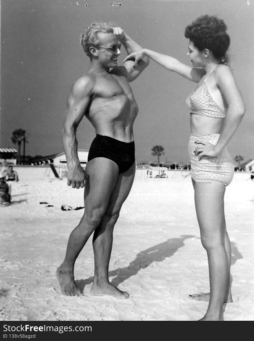 Phil King shows his muscles to Leatrice Jackson, of Hueytown, Ala. - Panama City Beach