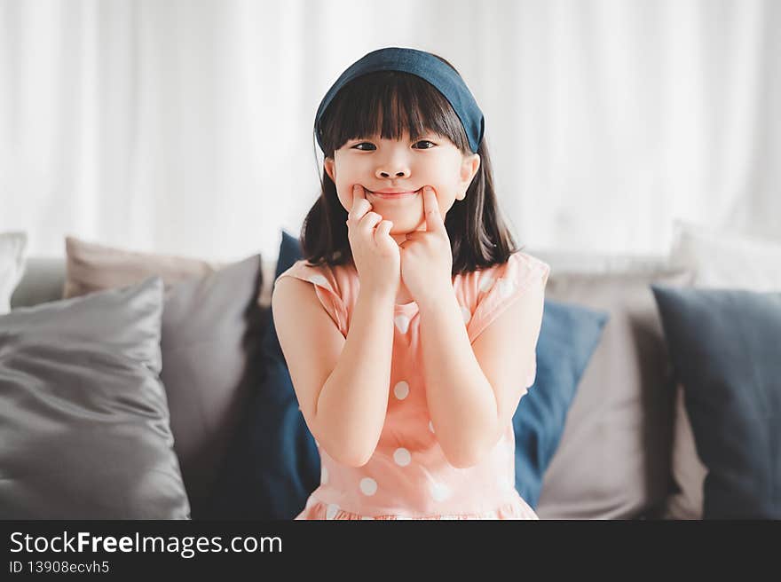 Little asian girl making funny face