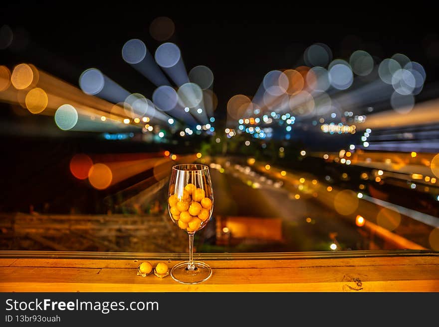 Cape Gooseberry fruits for health in a wine glass on bokeh background. Image effect rotating the lens in shooting