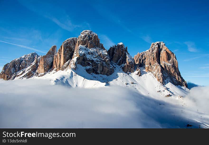 Skiing above the clouds in Dolomites, Italy. Skiing above the clouds in Dolomites, Italy