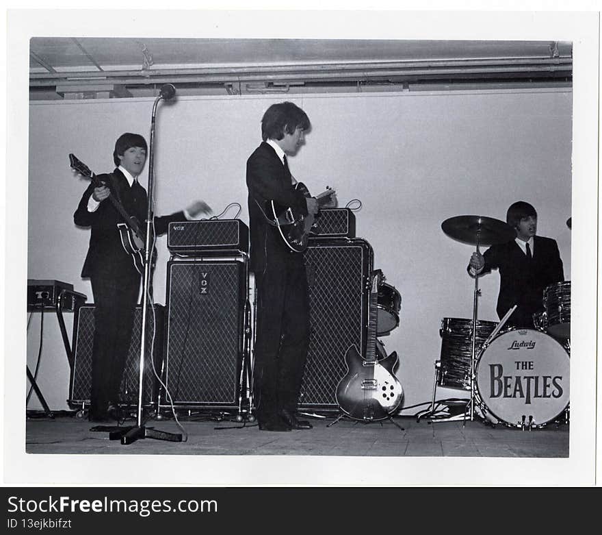 Creator: Nick Newbery

Date: 2nd November 1964. 

Original format: Photographic print.

Description: A photograph showing George, Paul &amp; Ringo playing a show at the King&#x27;s Hall, Belfast, in November 1964.

PRONI ref: D4542/2/1/4A

Picture Credit: Nick Newberry

Copying and copyright:
Please see http://www.proni.gov.uk/index/research_and_records_held/copying_and_copyright.htm

For Copy Orders, contact:
Email: proni@dcalni.gov.uk
For fees and charges see: http://www.proni.gov.uk/index/about_proni/are_there_any_fees_and_charges.htm. Creator: Nick Newbery

Date: 2nd November 1964. 

Original format: Photographic print.

Description: A photograph showing George, Paul &amp; Ringo playing a show at the King&#x27;s Hall, Belfast, in November 1964.

PRONI ref: D4542/2/1/4A

Picture Credit: Nick Newberry

Copying and copyright:
Please see http://www.proni.gov.uk/index/research_and_records_held/copying_and_copyright.htm

For Copy Orders, contact:
Email: proni@dcalni.gov.uk
For fees and charges see: http://www.proni.gov.uk/index/about_proni/are_there_any_fees_and_charges.htm