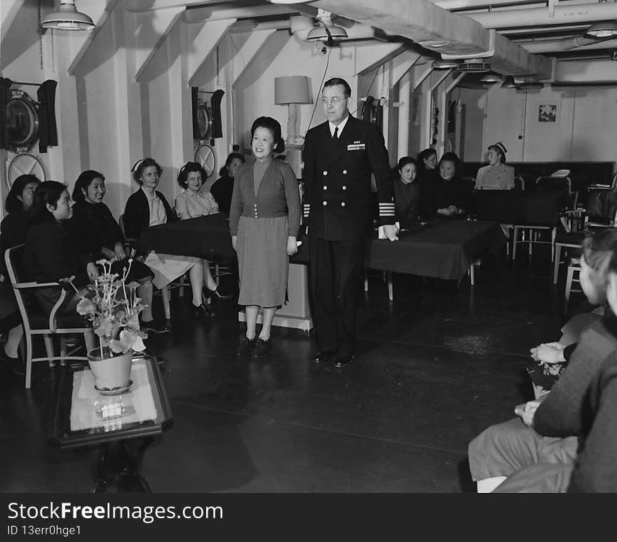 16-0022-002
b&amp;w 8x10 print
&quot;Navy nurses aboard the USS Repose &#x28;AH-16&#x29; at Tsingtao, China. Medical officer acts as interpreter during visit of Chinese nurses.&quot; Ca. June 22, 1948. Photo by Paul King, PhoM.  [hospital ship].
USN 392762