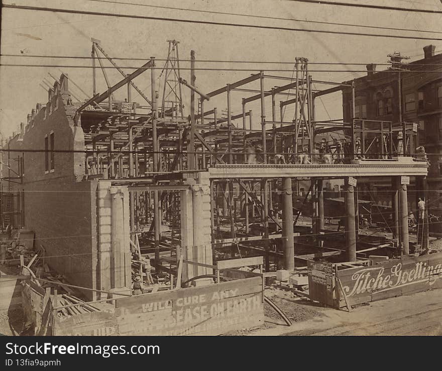 Title: [Wilson Building Construction, Intersection of North Ervay and Elm Street]

Creator: Hudson

Date: 1902

Series: Series 3: Photographs; Series 3, Subseries 5, Locations; Series 3, Subseries 5a, Dallas city views

Part of: George W. Cook Dallas/Texas image collection

Place: Dallas, Dallas County, Texas

Description: Construction of the Wilson Building at the intersection of Ervay and Elm Street. Designed by the Fort Worth firm of Sanguinet &amp; Staats, the Wilson Building is a French Renaissance / Second Empire style building, modeled after the Paris Grand Opera House. The building would eventually open in 1904, with the Titche-Goettinger department store occupying the basement and first two floors of the building. Source: Paula Bosse, The Wilson Building Under Construction - 1902, Flashback: Dallas, January 29, 2015, http://flashbackdallas.com/2015/01/29/wilson-bldg-under-construction-1902/ Visible, just beyond the construction site, are the offices of noted surgeon, Dr. Henry K. Leake. Dr. Leake was president of the Texas State Medical Association, and editor of the journal the Texas Medical Record. Source: Ronald Coy Jones, History of the Department of Surgery at Baylor University Medical Center: Surgery in Dallas, 1875-1900, Baylor University Medical Center Proceedings, April 2004, www.ncbi.nlm.nih.gov/pmc/articles/PMC1200650/

Physical Description: 1 photograph: gelatin silver; 26.7 x 34.2 cm on 30 x 35.6 cm mount

File: a2014_0020_3_5_a_0008_r_construction_opt.jpg

Rights: Please cite DeGolyer Library, Southern Methodist University when using this file. A high-resolution version of this file may be obtained for a fee. For details see the sites.smu.edu/cul/degolyer/research/permissions/ web page. For other information, contact degolyer@smu.edu.

For more information and to view the image in high resolution, see: digitalcollections.smu.edu/cdm/ref/collection/gcd/id/66/

View the George W. Cook Dallas/Texas Image Collection