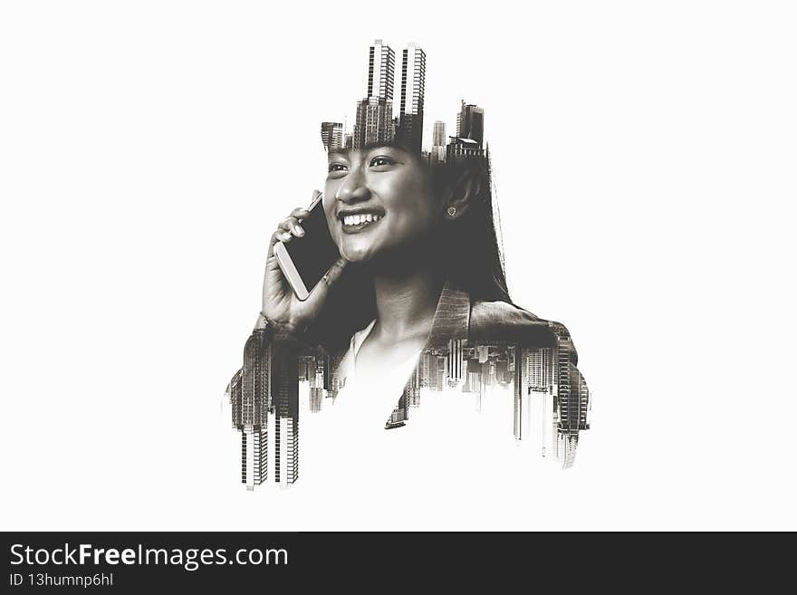 Image of a businesswoman talking on a mobile phone in the city. Double exposure