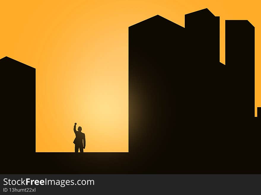 Silhouette of a businessman standing and raised hands