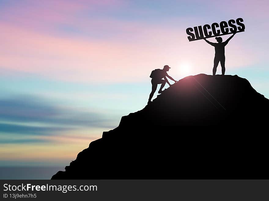 The man raised his hand happily on the top of a high mountain. successful in doing business. A man holds up a letter of success on a hill. success concept