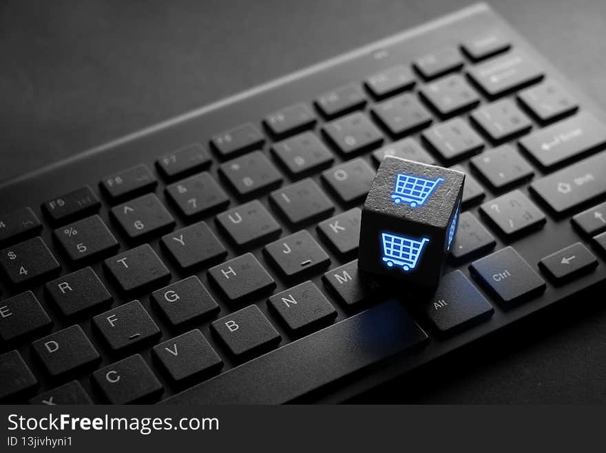 Online shopping & Social media icon on keyboard for global concept taken in studio