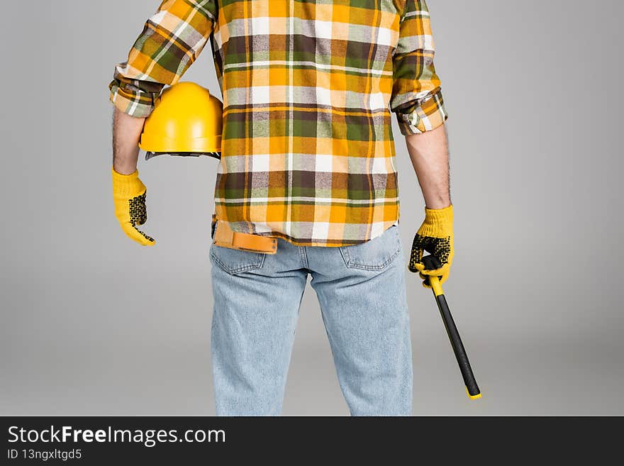 back view of handyman with hammer
