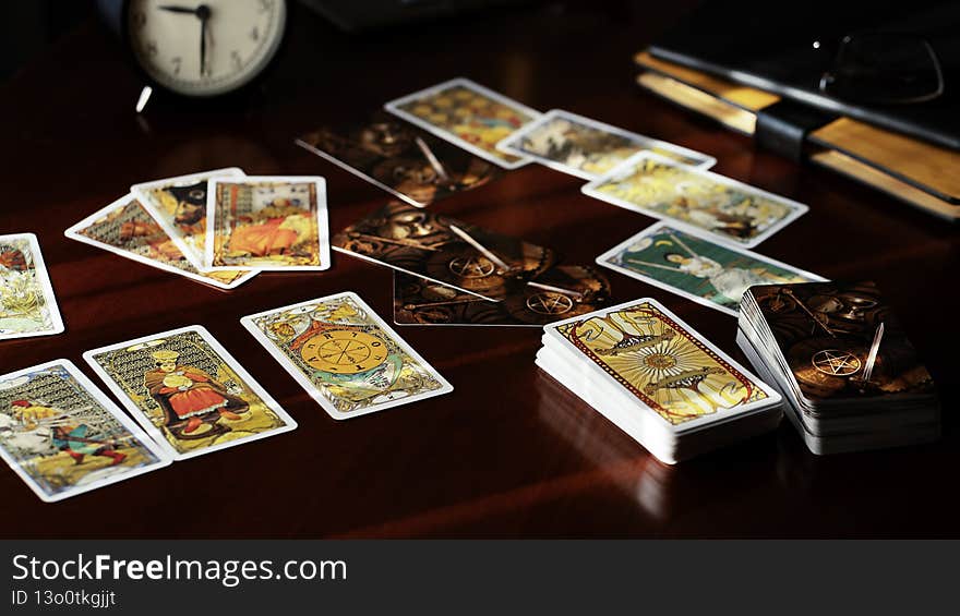 Blurred view of tarot card on the table, esoteric concept, fortune telling and predictions. High quality photo. Blurred view of tarot card on the table, esoteric concept, fortune telling and predictions. High quality photo
