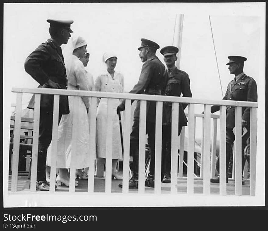 King George V is talking to three Australian nurses. The nurses are dressed in crisp white uniforms, and the King and the three men with him are also in uniform. They all appear to be standing on a deck or platform. During their visits to the Western Front, King George V and Queen Mary toured many hospitals spending time with both staff and patients. 

Nursing was just one way in which women could play an active role in the war. Others included construction and repair work, clerical and administrative work, driver, telephone operator and telegraphist.

[Original reads: &#x27; &#x27;OFFICIAL PHOTOGRAPHS TAKEN ON THE BRITISH WESTERN FRONT. H.M. receiving the Australian nurses who are serving French military hospital [sic].&#x27;]

digital.nls.uk/74547768. King George V is talking to three Australian nurses. The nurses are dressed in crisp white uniforms, and the King and the three men with him are also in uniform. They all appear to be standing on a deck or platform. During their visits to the Western Front, King George V and Queen Mary toured many hospitals spending time with both staff and patients. 

Nursing was just one way in which women could play an active role in the war. Others included construction and repair work, clerical and administrative work, driver, telephone operator and telegraphist.

[Original reads: &#x27; &#x27;OFFICIAL PHOTOGRAPHS TAKEN ON THE BRITISH WESTERN FRONT. H.M. receiving the Australian nurses who are serving French military hospital [sic].&#x27;]

digital.nls.uk/74547768