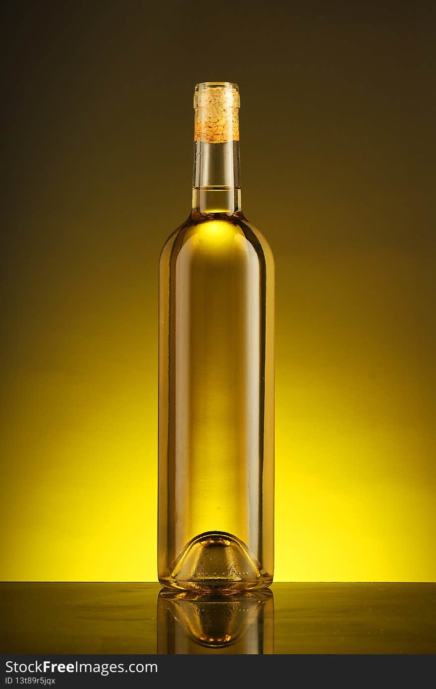 Full bottle of semi-sweet wine on a yellow background