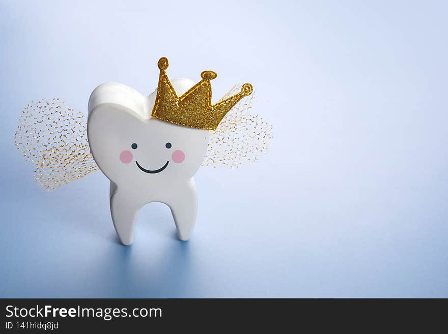 National Tooth Fairy Day. Children tooth fairy. Cute tooth with wings, a crown.