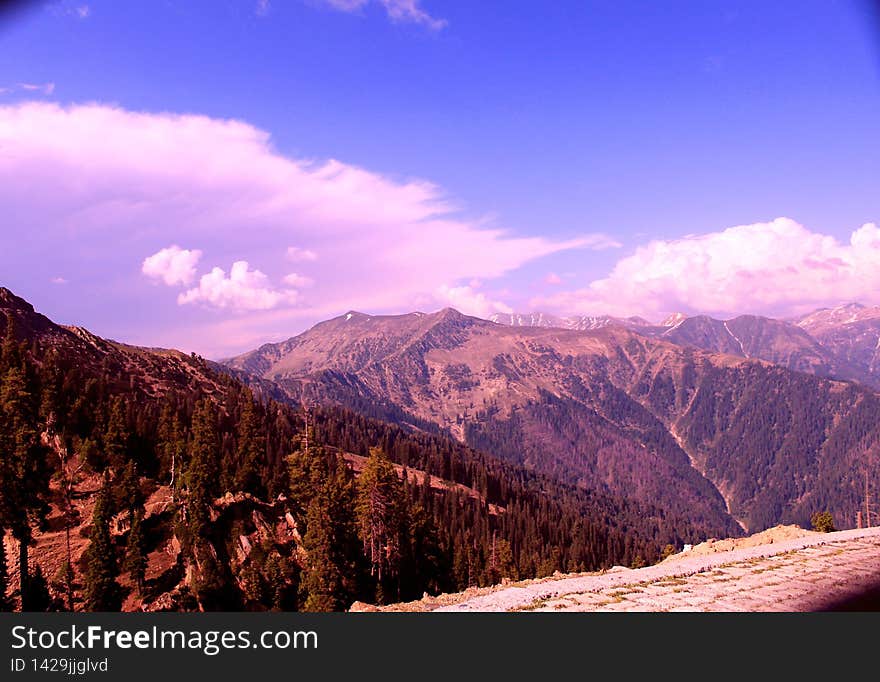 If you say that you feel on top of the world, you are emphasizing that you feel extremely happy and healthy. The clouds touching the mountain peaks...